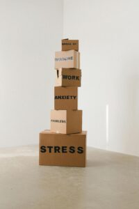 Stack of boxes with labels like stress problems, work, anxiety
